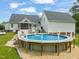 An above-ground pool with a charming deck, perfect for summer relaxation and entertainment at 140 Crystal Pl, Benson, NC 27504