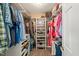 Well-organized walk-in closet featuring shelving for shoes and ample storage for clothing and accessories at 140 Crystal Pl, Benson, NC 27504