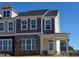 Charming townhome featuring stone accents, neutral siding and a welcoming front entrance at 1569 Wendell Valley Blvd, Wendell, NC 27591