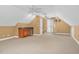 This bonus room features carpet, a bar area, a window, and white ceilings at 1576 Cheves Rd, Zebulon, NC 27597