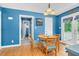 Cozy dining area showcasing hardwood floors, a round table, and French doors to the outside at 1576 Cheves Rd, Zebulon, NC 27597