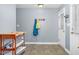 Mud room features tile flooring, light blue wall color, coat rack, and white exterior door at 1576 Cheves Rd, Zebulon, NC 27597