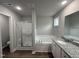 Bathroom featuring a separate shower, tub, vanity and granite countertop at 163 Oakfield Trace Dr, Four Oaks, NC 27524