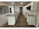 Well-lit kitchen featuring granite counters and white cabinets in an open-concept layout at 163 Oakfield Trace Dr, Four Oaks, NC 27524