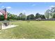 Spacious backyard perfect for outdoor activities, featuring mature trees and a large grassy area at 180 Packhouse Ct, Angier, NC 27501