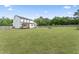 Large fenced backyard with lush green grass, perfect for recreation and Gathering enjoyment at 180 Packhouse Ct, Angier, NC 27501