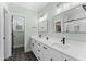 Spa-like bathroom with dual sinks, modern fixtures, and a bright, clean design at 180 Packhouse Ct, Angier, NC 27501