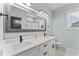 Modern bathroom featuring double sinks, black hardware and a large mirror for a spa-like feel at 180 Packhouse Ct, Angier, NC 27501
