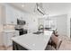 Bright kitchen with quartz countertops, white cabinets, stainless steel appliances, and a stylish island at 180 Packhouse Ct, Angier, NC 27501