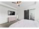Comfortable main bedroom with a ceiling fan, ensuite bathroom access, and a soft, inviting bed at 180 Packhouse Ct, Angier, NC 27501