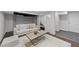 Cozy basement featuring neutral tones, a comfortable sofa, and an open living space at 1809 Glendale Ave, Durham, NC 27701