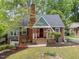Charming brick home with a well-manicured front yard and inviting entrance, perfect for a cozy Gathering at 1809 Glendale Ave, Durham, NC 27701