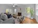 Bright living room with fireplace, hardwood floors, and large windows offering natural light at 1809 Glendale Ave, Durham, NC 27701