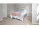 Bright bedroom features stylish decor and carpet flooring, complemented by gray walls at 1832 Elkpark Dr, Raleigh, NC 27610