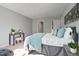 Bright bedroom features calming gray walls, carpeted floors, and a comfortable bed with stylish accents at 1832 Elkpark Dr, Raleigh, NC 27610
