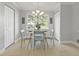 Cozy dining area with views to the outside through large picture window at 1832 Elkpark Dr, Raleigh, NC 27610