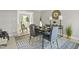 Stylish dining room with a modern table set and decorative rug at 1832 Elkpark Dr, Raleigh, NC 27610