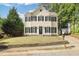 Charming two-story home with a well-maintained front yard and classic architectural details at 1832 Elkpark Dr, Raleigh, NC 27610
