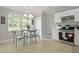 Bright eat-in kitchen with stainless steel appliances and a view of the backyard at 1832 Elkpark Dr, Raleigh, NC 27610