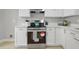 Well-equipped kitchen with sleek appliances, light countertops, and ample cabinet space at 1832 Elkpark Dr, Raleigh, NC 27610