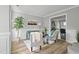Bright living room with hardwood floors, stylish furniture, and elegant wall paneling at 1832 Elkpark Dr, Raleigh, NC 27610