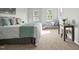 Bright main bedroom with great lighting, comfortable seating area, and neutral decor at 1832 Elkpark Dr, Raleigh, NC 27610