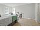 Spacious bedroom featuring natural light and ample space for seating, creating a cozy retreat at 1832 Elkpark Dr, Raleigh, NC 27610