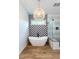 Sleek bathroom with a freestanding tub, glass-enclosed shower, and stylish wallpaper at 200 Larkhaven Pl, Apex, NC 27539