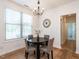 Cozy dining room with a chandelier and window providing ample natural light at 200 Larkhaven Pl, Apex, NC 27539