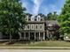 Charming two-story home with a front porch and a well-manicured lawn at 200 Larkhaven Pl, Apex, NC 27539