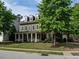 Charming two-story home with a welcoming front porch and mature landscaping at 200 Larkhaven Pl, Apex, NC 27539