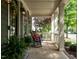 Relaxing front porch with rocking chairs, perfect for enjoying the outdoors at 200 Larkhaven Pl, Apex, NC 27539