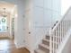 Bright foyer with staircase featuring white walls and hardwood floors at 200 Larkhaven Pl, Apex, NC 27539