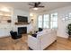 Inviting living room with fireplace, built-in shelves, and modern furniture at 200 Larkhaven Pl, Apex, NC 27539
