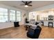 Open living space featuring hardwood floors and large windows providing ample natural light at 200 Larkhaven Pl, Apex, NC 27539