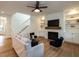 Comfortable living room with a fireplace, hardwood floors, and plenty of natural light at 200 Larkhaven Pl, Apex, NC 27539