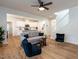 Bright living room featuring hardwood floors, neutral colors, and ceiling fan at 200 Larkhaven Pl, Apex, NC 27539
