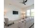 Cozy living room with neutral tones, comfortable seating, and a modern ceiling fan at 200 Larkhaven Pl, Apex, NC 27539