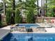 Close-up detail of the in-ground spa with stone accents and a relaxing waterfall feature at 200 Larkhaven Pl, Apex, NC 27539