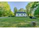 Backyard view of the home's exterior and grassy expanse at 2021 Bundy Ave, Durham, NC 27704