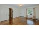 Inviting living room offers hardwood floors, white trim, and a large window at 2021 Bundy Ave, Durham, NC 27704