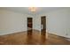 Spacious living room showcases hardwood floors and multiple entryways for easy flow at 2021 Bundy Ave, Durham, NC 27704