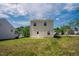 A well-maintained backyard with plenty of green space and a view of the sky at 2032 Lime St, Durham, NC 27704