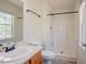 Bright bathroom with a walk-in shower, updated fixtures, and neutral colors at 2032 Lime St, Durham, NC 27704
