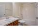Bathroom with a single sink vanity and shower/tub combination at 2032 Lime St, Durham, NC 27704