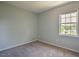 Bedroom features carpeted floors and a window for plenty of natural light at 2032 Lime St, Durham, NC 27704