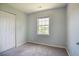 Bedroom features carpeted floors and a window for plenty of natural light at 2032 Lime St, Durham, NC 27704