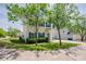 View of home with blue shutters and lush landscaping at 2032 Lime St, Durham, NC 27704