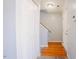 Hallway featuring hardwood flooring and white trim at 2032 Lime St, Durham, NC 27704