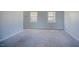 Neutral carpeted living room with natural lighting at 2032 Lime St, Durham, NC 27704